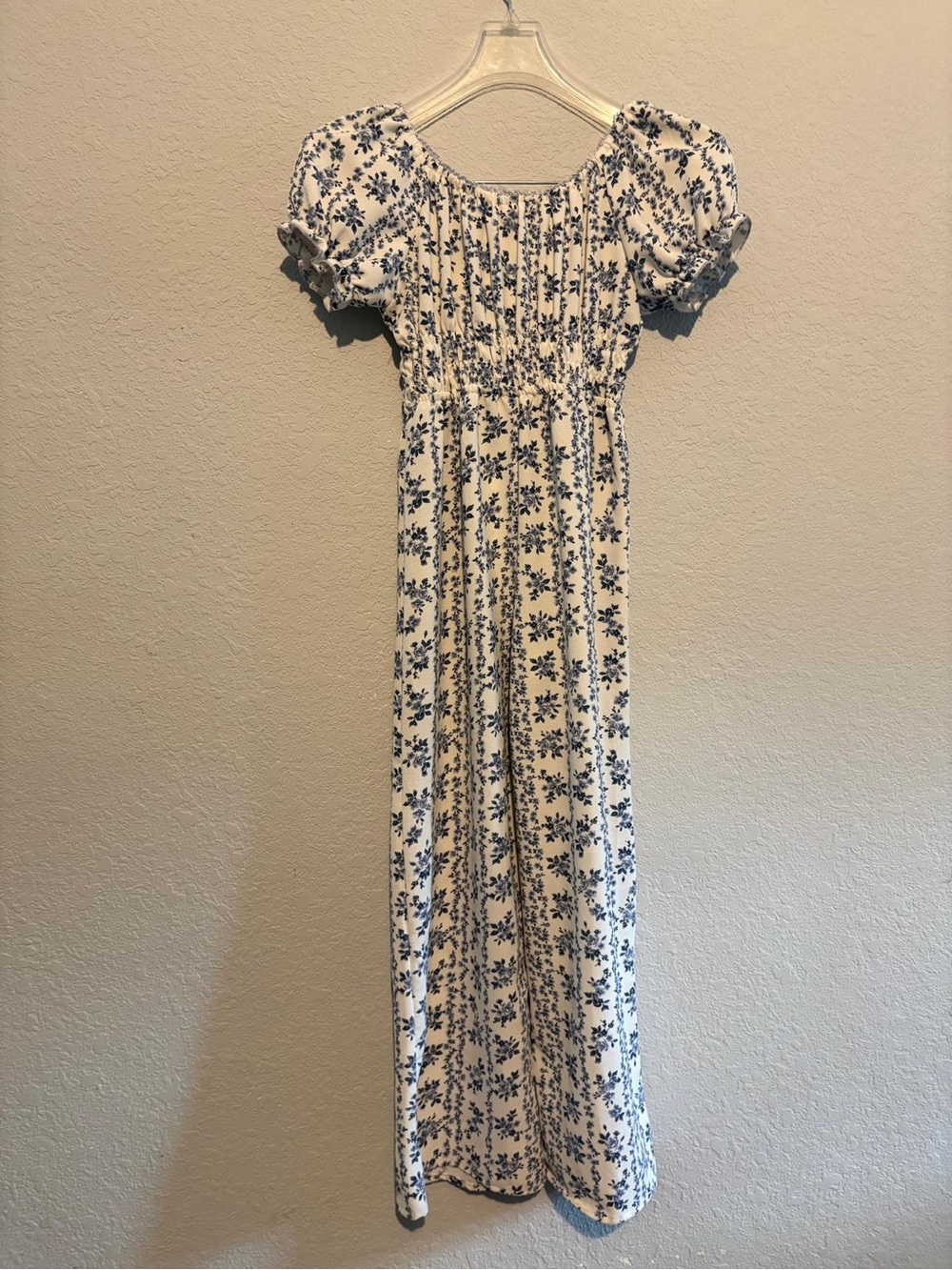 Cream Floral Smocked jumpsuit.